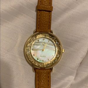 watch w/ mother of pearl, loose gems around face